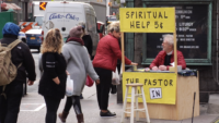 Pastor Offers Spiritual Help From a Booth