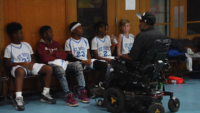 Coach Inspires Players From His Wheelchair