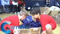 Favors of Faith: Students Prepare Bags for Diocesan Eucharistic Revival