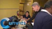 Lending a Helping Hand: Bishop Brennan Helps Feed Incoming Migrants