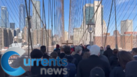 Pilgrims Walk Across the Brooklyn Bridge on Good Friday for the Way of the Cross Procession
