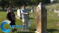 Brushing Up On History: Father and Son Clean Headstones at Catholic Cemetery