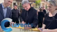Parish Celebrates 120 years: Bishop Brennan Signs Anniversary Committee Sashes