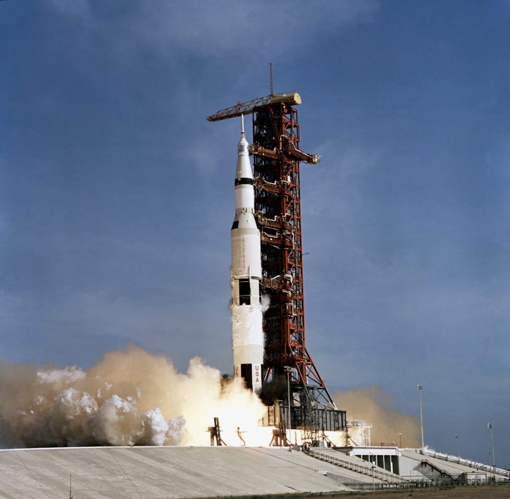 Apollo 11 space vehicle taking off from Kennedy Space Center.