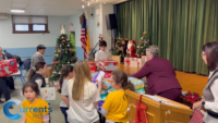 Astoria Catholic Academy Students Turn Tree Lighting Into Christmas Mission of Charity